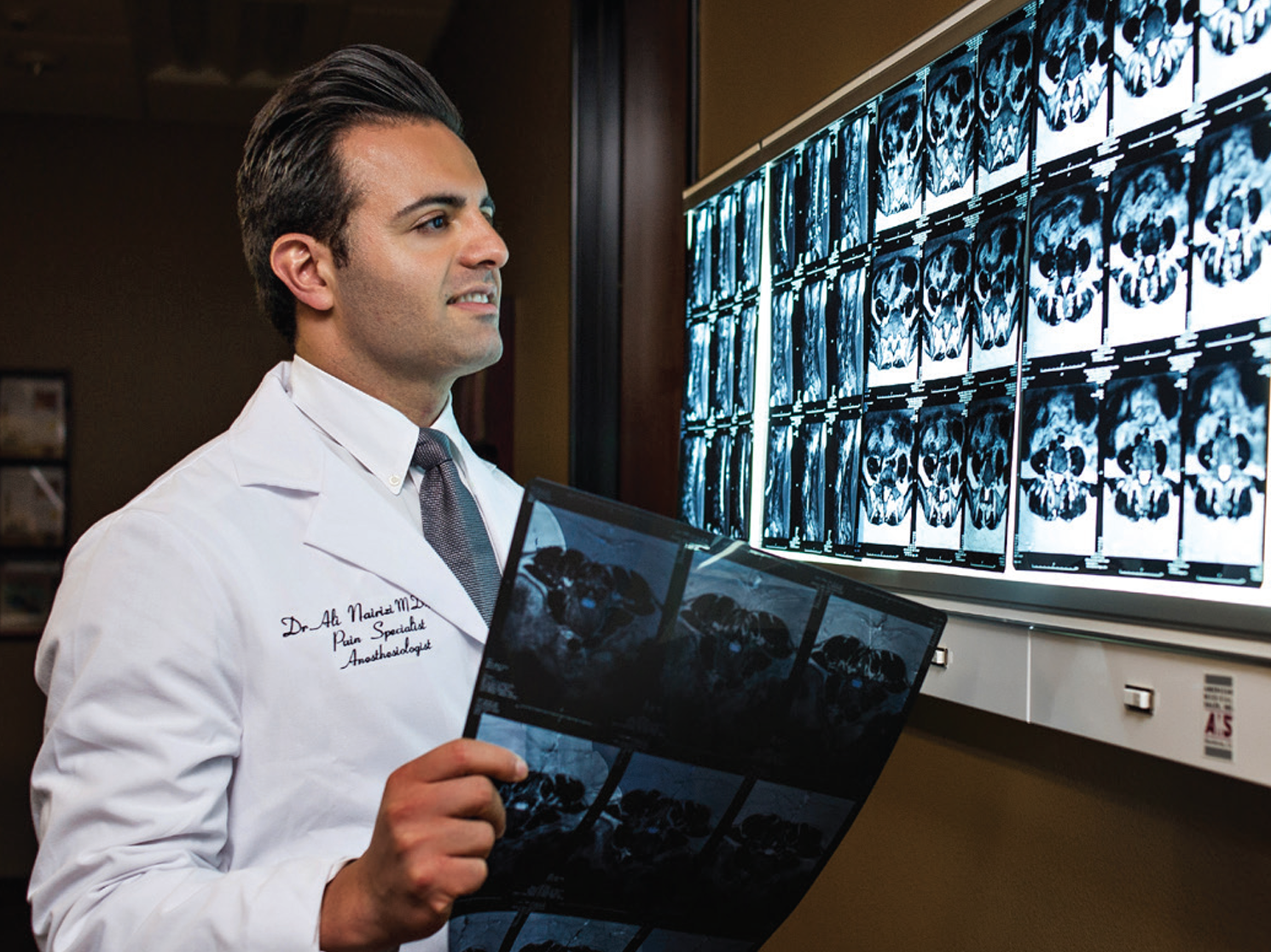 Dr. Ali Nairizi, Founder of UPUC, reviews patient medical imagery